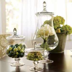 The Allure of Decorating with Glass Jars showcased through three jars on a table.