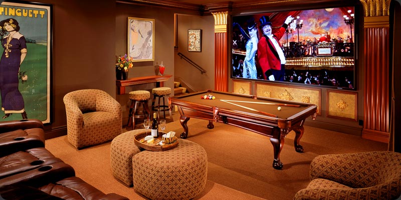 A home game room with a pool table and chairs.