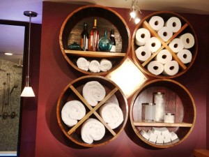 A unique bathroom design featuring creative shelf ideas using wooden barrels.