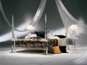 A versatile bed in a room with curtains and a durable bedside lamp.
