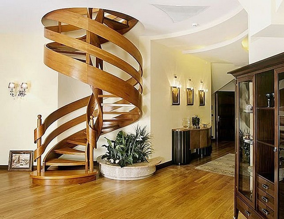 A spiral staircase that inspires in a living room.