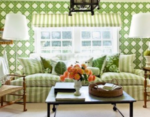 A living room with green wallpaper.