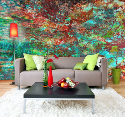 A living room with an enlivening mural on the wall.