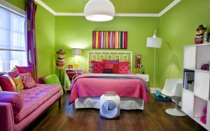 A bold and colorful bedroom with a bed and a bedside table.