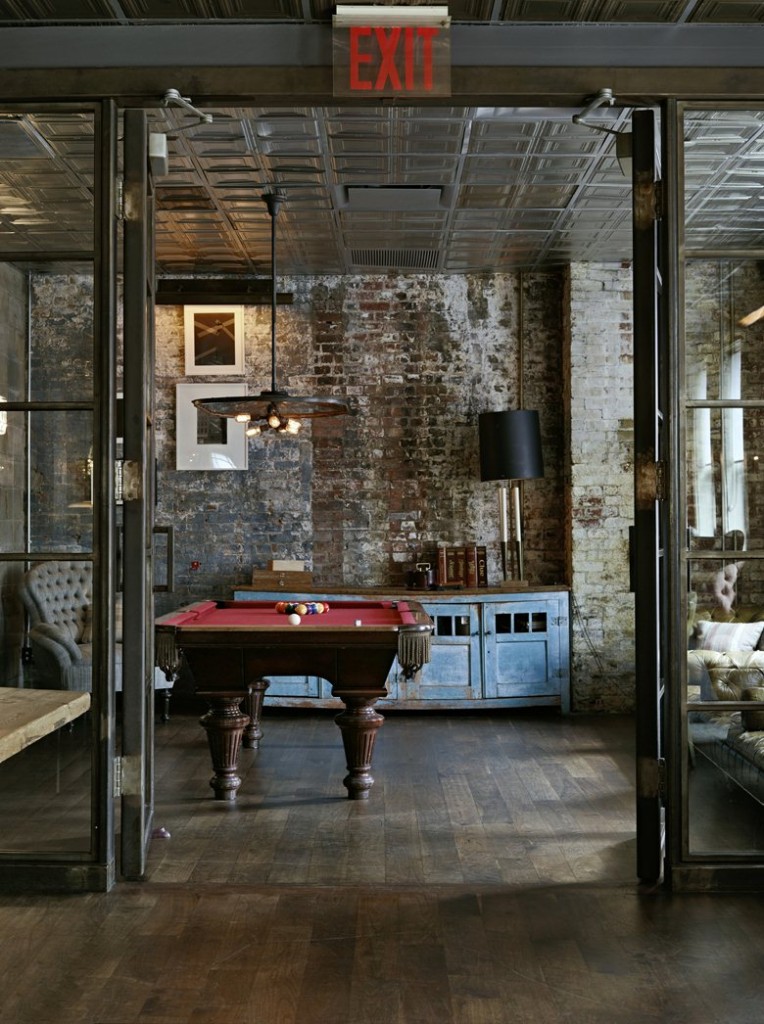A room with a steampunk pool table.