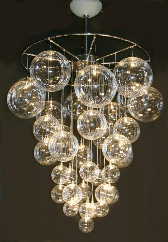 Shimmering glass balls hanging from a chandelier.