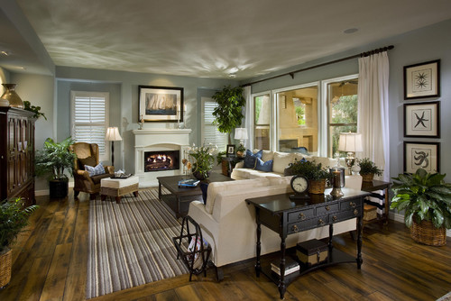 A cozy living space with a fireplace and hardwood floors.