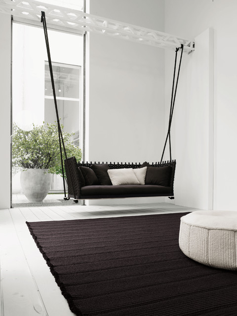 A black and white room with a swing.