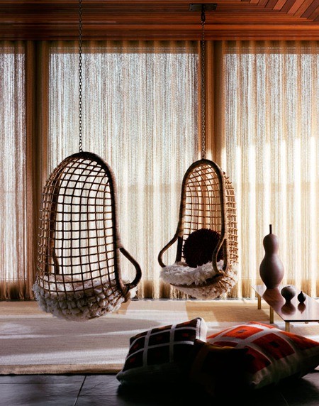Two rattan hanging chairs, perfect for indoor swings.
