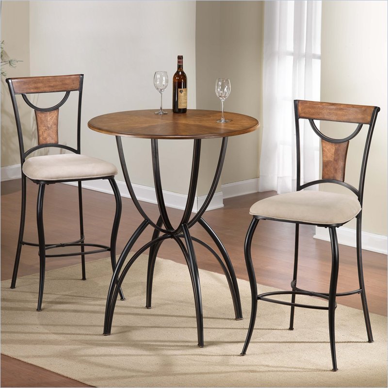 Two bar stools and a table in a room, creating a functional entertaining space.
