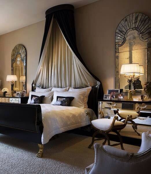 A black and gold canopy bed to create a romantic bedroom.
