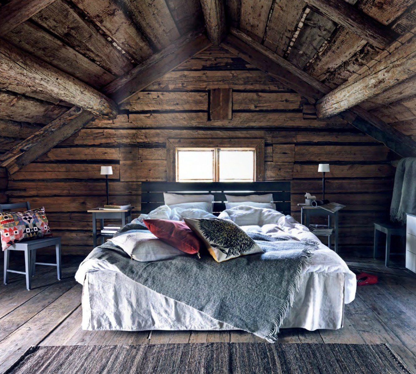 A Scandinavian-inspired bed in an attic.