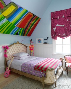 A colorful girl's bedroom with paintings on the ceiling.