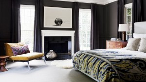 A bedroom with black walls in one of the top 2015 colors.