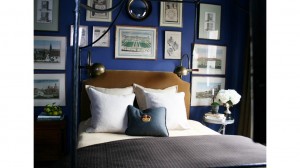 A blue bedroom with framed pictures in one of the top bedroom colors of 2015.