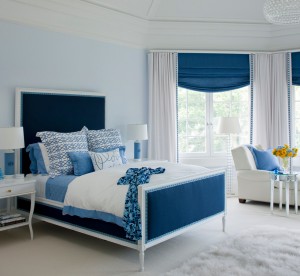 A trendy bedroom featuring blue and white, two of the top bedroom colors of 2015.