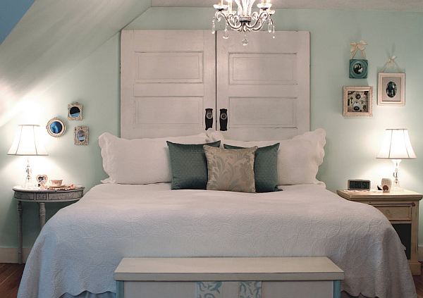 A bedroom with a bed and dresser.