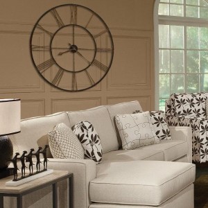 A living room with furniture and clocks.