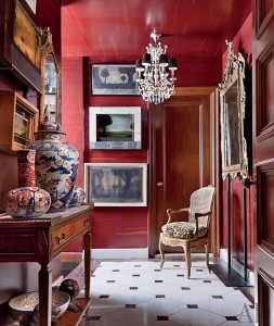 A hallway with marsala walls and furniture.