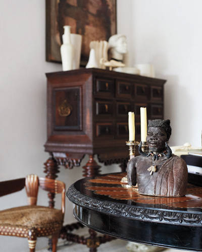A global chic table with a statue.