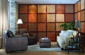 A living room with a textured wooden wall.