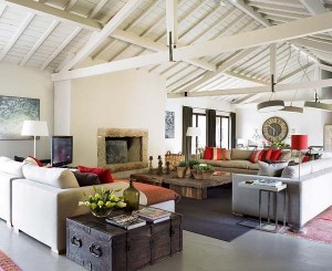 A living room with red couches showcasing texture.