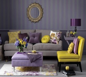 A living room with gray interiors and purple accents.