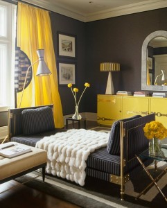 A living room with yellow curtains.