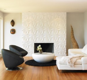 A living room with white furniture and a textured fireplace.