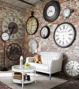 A living room with multiple clocks on the wall.
