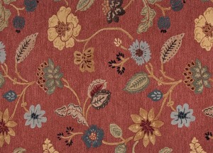 A marsala floral pattern on a red carpet.