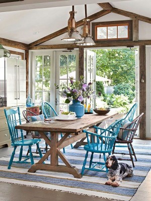 A dining room with blue chairs.