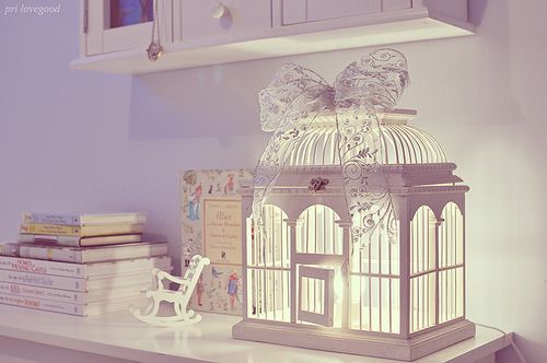 Decorating with a white birdcage.