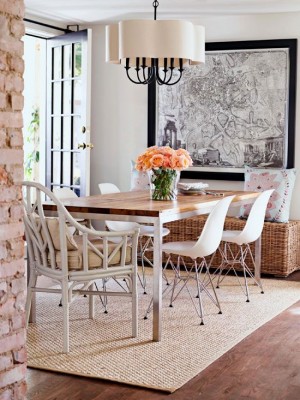 A dining room with white chairs.
