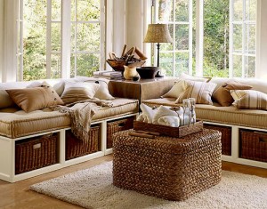 A living room with textured wicker furniture and a coffee table.