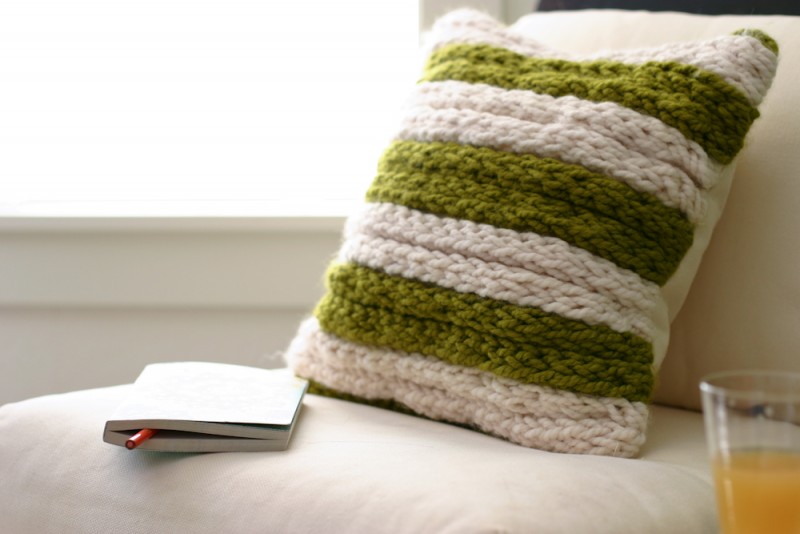 A green and white striped pillow using knits in your home décor.