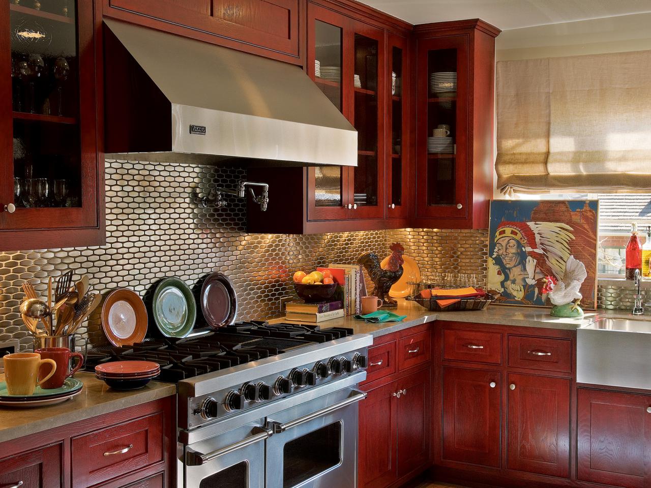 A kitchen with red cabinets.