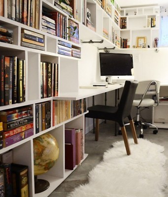 A home office with bookshelves.