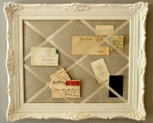 A picture frame adorned with vintage postcards.