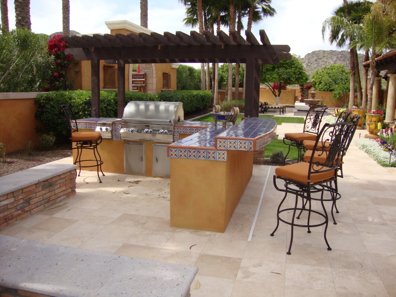 A patio with an outdoor kitchen.