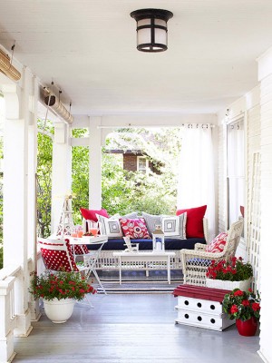 A front porch with red, white, and blue decor.