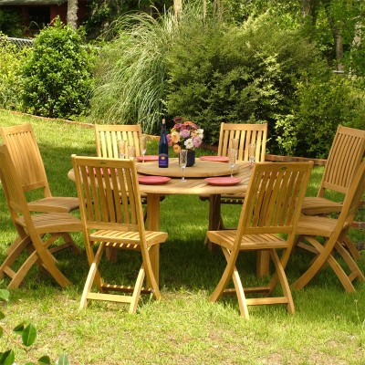 A wooden table and chairs for backyard dining.