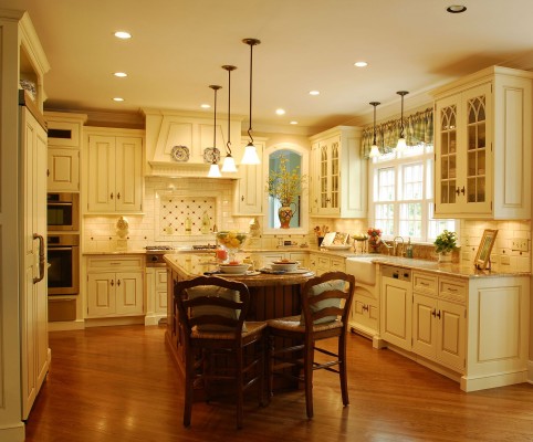 A traditional kitchen with a center island.