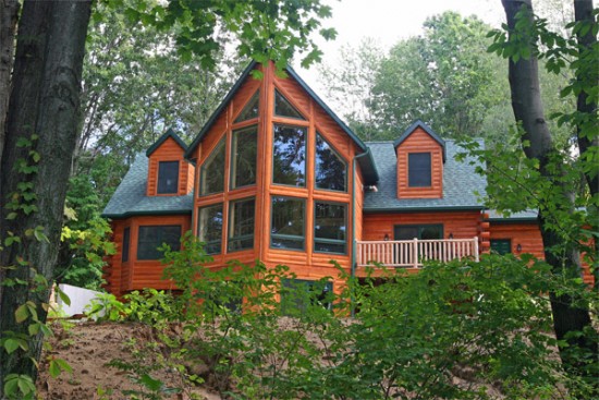 Gorgeous windows in this log cabin for an expansive view (dfdhouseplans) 