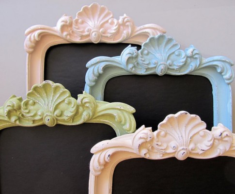 Four picture frames with ornate designs on them.