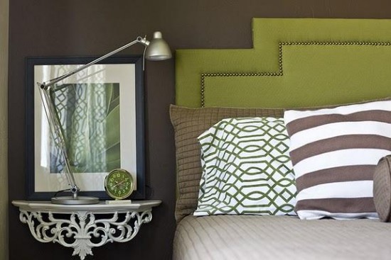 Choosing and styling a bedside table for a bed with a green and white striped headboard.