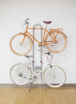 Two bicycles stacked for storage.