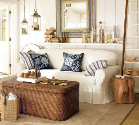 A living room with a white couch and wicker baskets, offering coffee table alternatives.