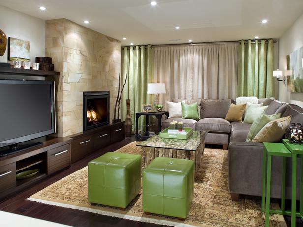 A living room with green accents and a fireplace.