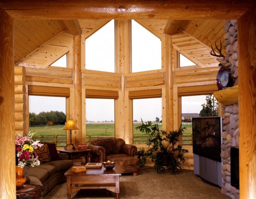 Expansive windows brighten this log home (homeplusdecor)